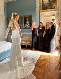 a group of women standing around each other in a room