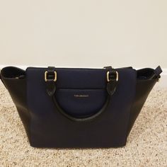 Nwot! Vera Bradley Navy With Black Leather Morgan Satchel. Comes With A Removable Long Strap And A Dustbag. Gorgeous! Bottom Length: 10.5" Width: 5.5" Middle Height: 9.5" Elegant Black Satchel With Leather Trim, Navy Leather Shoulder Bag With Detachable Handle, Elegant Tan Satchel For Work, Elegant Navy Top Handle Satchel, Elegant Business Satchel With Leather Trim, Chic Business Satchel With Leather Trim, Chic Satchel With Leather Trim For Business, Elegant Leather Trim Evening Satchel, Elegant Navy Shoulder Bag With Gold-tone Hardware