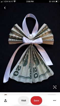 an origami bow made out of money