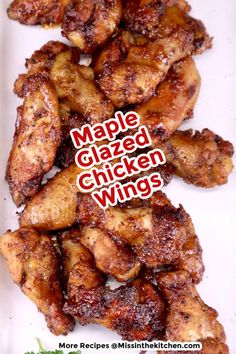 some chicken wings on a white plate with the words maple glazed chicken wings above them