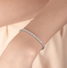 Tennis Bracelet | S925 Sterling Silver, Simulated Diamond Bracelet | Gifted Jewelry 𝐃𝐞𝐬𝐜𝐫𝐢𝐩𝐭𝐢𝐨𝐧 ✧ 𝐏𝐫𝐞𝐦𝐢𝐮𝐦 𝐐𝐮𝐚𝐥𝐢𝐭𝐲 𝐌𝐚𝐭𝐞𝐫𝐢𝐚𝐥: Crafted from high-quality S925 sterling silver for lasting shine and durability. ✧ 𝐂𝐮𝐛𝐢𝐜 𝐙𝐢𝐫𝐜𝐨𝐧𝐢𝐚 𝐒𝐭𝐨𝐧𝐞𝐬: Each CZ stone is carefully selected to mimic the brilliance of real diamonds, providing an ethical and affordable luxury. ✧ 𝐂𝐥𝐚𝐬𝐬𝐢𝐜 𝐒𝐭𝐲𝐥𝐞: The iconic tennis bracelet design ensures it complements any outfit. ✧ 𝐏𝐞𝐫𝐟𝐞𝐜𝐭 𝐆𝐢𝐟𝐭: Elegantly packaged, making it an ideal gift for any occasion. Elevate your style with our Tennis Bracelet, where sophistication meets affordability. 𝐒𝐩𝐞𝐜𝐢𝐟𝐢𝐜𝐚𝐭𝐢𝐨𝐧𝐬 − 𝐌𝐞𝐭𝐚𝐥: S925 Sterling Silver − 𝐅𝐢𝐧𝐢𝐬𝐡: Silver, Gold, Rose Gold − 𝐒𝐢𝐳𝐞: 6in, 7 Tennis Bracelet Silver, Luxury Silver Sterling Silver Tennis Bracelet, Classic Sterling Silver Bracelet With Prong Setting, Elegant Bangle Bracelet With Sterling Silver Clasp, Timeless Sterling Silver Tennis Bracelet For Formal Occasions, Cubic Zirconia Diamond Bracelet As Gift, Gift Cubic Zirconia Diamond Bracelet, Elegant Silver Diamond Bracelet With Prong Setting, Elegant Sterling Silver Bracelet With Cubic Zirconia