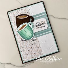 a close up of a card with a cup of coffee