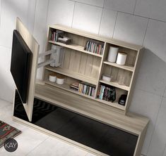 a tv and book shelf in a room