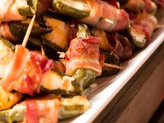 bacon and jalapeno kebabs are piled on top of each other