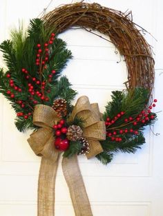 a christmas wreath hanging on the front door