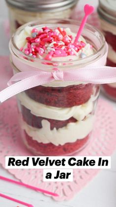 red velvet cake in a jar with sprinkles and pink ribbon on top