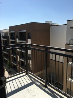 an apartment balcony with metal railings and balconies