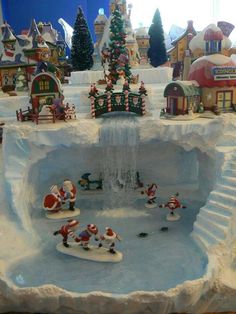 an ice rink with santas skating on it