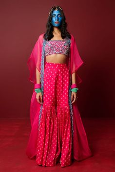 Magenta cape highlighted with dori embroidered border. Comes with embroidered padded blouse and butti pattern sharara. - Aza Fashions Chanderi Lehenga With Zari Work And Cape Sleeves, Navratri Palazzo Set With Zari Work And Cape Sleeves, Embroidered Sharara For Reception, Diwali Dupatta With Resham Embroidery And Cape Sleeves, Eid Sets With Dupatta And Cape Sleeves, Diwali Resham Embroidery Dupatta With Cape Sleeves, Festive Chanderi Lehenga With Cape Sleeves, Traditional Sharara With Cape Sleeves, Festive Designer Anarkali Set With Cape Sleeves