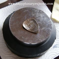 a heart shaped metal object sitting on top of a table