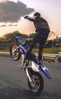 a person on a dirt bike doing a trick