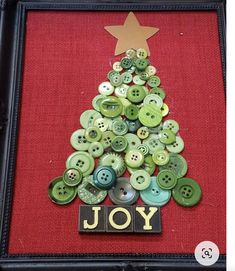 a christmas tree made out of buttons with the word joy on it