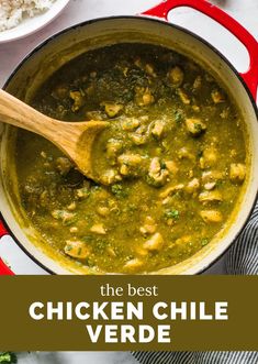 the best chicken chile verde soup in a red pot with a wooden spoon and rice