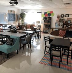 a room filled with lots of tables and chairs