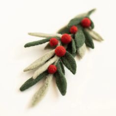 small green and red christmas tree decoration on white surface