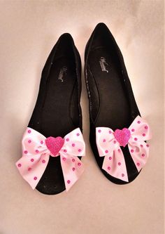 For your special Valentine! (Or, for yourself, to wear to a special February 14 celebration!) This pink Valentine's Day shoe clip, complete with a sparkly heart and hot pink dots will add to any formal or informal celebration. Great for weddings, too! Can be used on either women's or girls' shoes (might be a bit large for little girls' shoes.) -- Bow is made from pink satin ribbon. -- Each bow is approximately 3 ½ inches from side to side, and 2 ½ inches from top to bottom. -- Includes a sparkly heart in the center of each, and hot pink dots on the bows. -- Comes as a set of 2 matching clips. -- Production time generally takes 3 - 5 days before shipping. -- Will ship to anywhere in the US, and shipping is free on orders of $35 or more. -- Will include a ladybug on 1 of the 2 clips, maybe o Clown Shoes, Christmas Shoes, Heart Shoes, Pink Valentines, Bow Shoes, Valentine Special, Shoe Clips, Heart Love, Dream Shoes