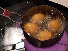 some food is cooking in a pan on the stove