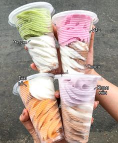 four different types of ice cream in plastic cups