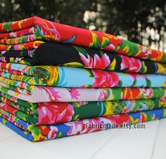 a stack of colorful cloths sitting on top of a table