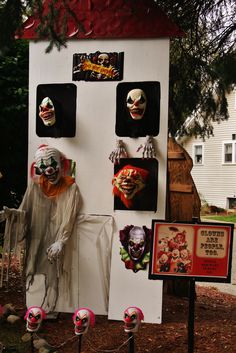 there are many scary masks on display in the yard