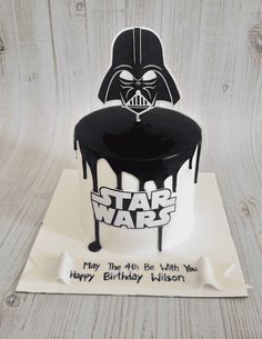 a darth vader birthday cake on top of a napkin