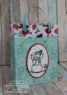 a paper bag with a snowman on it