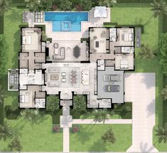 an aerial view of a large house with pool and patio area in the middle of it