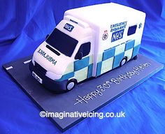 a cake shaped like a delivery truck on a blue tableclothed surface with the words happy birthday