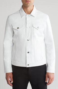 Make a clean, striking statement with this bright-white leather jacket in a casual-cool trucker profile. 26" length (size Medium) Front button closure Spread collar Button cuffs Chest button-flap patch pockets; front welt pockets Lined Leather Professional leather clean Made in the USA White Outerwear With Lapel Collar And Button Closure, White Lapel Collar Outerwear With Button Closure, White Single Breasted Button-up Outerwear, White Single-breasted Button-up Outerwear, White Button-up Outerwear With Button Cuffs, White Collared Outerwear With Button Closure, White Button-up Outerwear With Snap Buttons, Modern White Outerwear With Pockets, Classic White Outerwear With Buttons