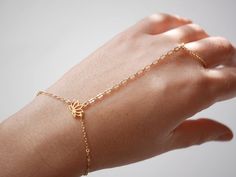 This Original Hand Jewelry is perfect for bridesmaid, wedding,... This Hand Bracelet is made with Gold plated differents chain, and Gold plated Lotus Flower.  ➵ Perfect to wear alone or for layering with more bracelets.➵ The bracelet length is ajustable thanks to 5 cm (2 in) extender chain.--*--*--*--*--*--*--*--*--*--*--*--*--*--*--*--*--*--*--∞ SIZE ∞- Bracelet length: Adjustable bracelet - around 15 cm (5.9 in) - 20 cm (7.9 in).If you like another length please make a note when you "check out Gold Hand Jewelry, Gold Ring Bracelet, Black Gold Necklace, Stackable Necklaces, Finger Bracelets, Gold Bracelet Simple, Boho Jewels, Bracelet And Ring, Cat Earrings Studs