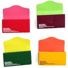 four different colored business card holders on top of each other