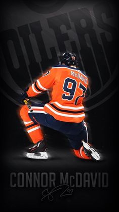 an image of a hockey player on the ice with his name written in black and orange