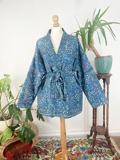 "Express Urgent Upgrade at Checkout only for Domestic Uk Pre Christmas Deliveries applicable for Mainland only until Friday 12 Noon .Elegant High Quality Extra Fine Kantha repurposed with handBlock Floral printing and then styled into Jacket Coat with pockets . Note : this is a light-mid weight jacket !! Matching piping detail all over to add definition on the reverse side . Each Piece is handcrafted with utmost attention to detail.  This Piece is reversible and is Gorgeous to be worn on the oth Blue Bohemian Outerwear With Pockets, Blue Long-sleeve Outerwear For Festivals, Blue Long Sleeve Outerwear For Festivals, Bohemian Indigo Long Sleeve Kimono, Indigo Long Sleeve Bohemian Kimono, Blue Cotton Kimono For Festival, Blue Long-sleeved Cotton Kimono, Blue Cotton Long Sleeve Kimono, Long Sleeve Indigo Bohemian Kimono