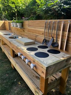 a wooden bench with pots and pans on it