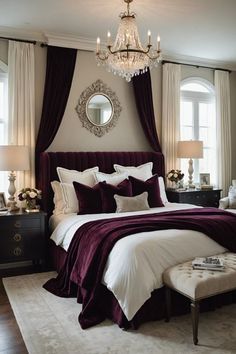 a bedroom with a large bed, chandelier and purple drapes on the windows