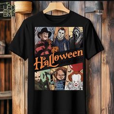 Fall Pop Culture T-shirt With Character Print, Black T-shirt For Halloween And Fan Conventions, Black Themed Top With Sublimation Print, Funny Halloween T-shirt With Character Print, Halloween Fan Merchandise T-shirt With Sublimation Print, Halloween Crew Neck Tops For Fan Conventions, Halloween Themed Short Sleeve Shirt, Fall Season Pop Culture T-shirt With Character Print, Themed Halloween Short Sleeve Shirt