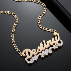 Introducing our Custom Nameplate Necklace, elegantly accented with an underlined heart scroll and personalized with your desired text.  Handcrafted from 18k Gold plated stainless steel, it's waterproof, hypoallergenic, rust-resistant, and Non Tarnish, designed to last forever!  KEY FEATURES: -Waterproof, NON TARNISH, rust-resistant, hypoallergenic and everlasting. -Material: 18k Gold plated, 18k Rose Gold plated, or Stainless Steel. -Chain Length: 14 inches, 16 inches, 18 inches, 20 inches. -All Name Chain, Double Name, Nameplate Necklace, Jewelry Safe, Waterproof Jewelry, Custom Name Necklace, Pendant Design, Stainless Steel Necklace, Name Plate