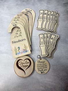 some wooden magnets and tags on a table