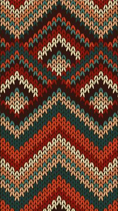 an abstract knitted pattern in red, blue and green