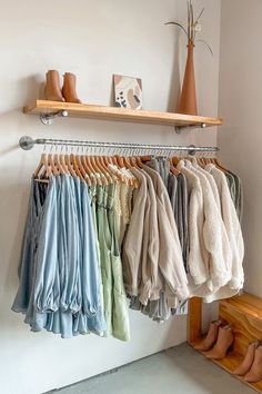 a rack with clothes and shoes hanging on it