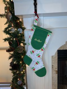 christmas stockings hanging from the fireplace in front of a fire place