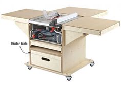 a workbench with a table sawing machine on it's side and drawers underneath