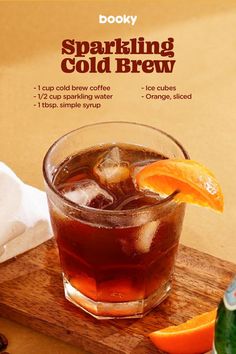 an advertisement for sparkling cold brew on a cutting board with orange slices and coffee beans