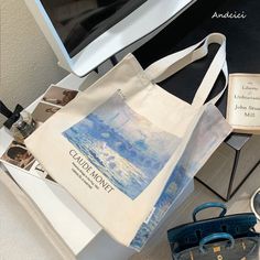 A tote bag depicting Monet's "Waterloo Bridge in the Fog".
 The beautiful water surface reflecting the sunlight and the Waterloo Bridge wrapped in fog are beautifully drawn.
 The fantastic scenery drawn in vivid colors will make you feel better.





 <Size>



 Height: 36cm

 Width: 36cm

 Gusset: 10cm






 <Material>



 thick canvas fabric Artistic Summer Shoulder Bag For Daily Use, Artistic Shoulder Bag For Daily Summer Use, Artistic Summer Canvas Tote Bag, Artistic Rectangular Canvas Bag For Summer, Artistic Summer Tote Shoulder Bag, Artistic Summer Shoulder Bag, Artistic Large Capacity Canvas Travel Bag, Artistic Canvas Bag With Large Capacity For Daily Use, Artistic Large Capacity Canvas Bag For Daily Use