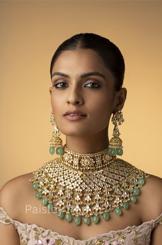 The Kundan necklace set with mint fluorite stones is a beautiful piece of bridal jewelry designed and handcrafted by Indian artisans with traditional Indian Jewelry making techniques The lustrous beauty of the antique Kundan gold-plated necklace instills a sense of nostalgia and likely takes you down to old memories. Sabyasachi jewelry inspired Kundan necklace set is an epode to the rich culture of India with its matching jhumka earrings that bring together the blend of techniques and semi-precious gemstones. Necklace Closure: Adjustable Dori Earrings Closure: Pushback Style Tip - This one is for all the women lovers of poetic lyricism and romanticism of the bygone era and women who want all of their selections to be a reflection of their true selves. The cascading elements in the Kundan n Jhumka Earrings Gold, Culture Of India, Luxury Jewelry Store, Sabyasachi Jewelry, Kundan Necklace Set, Sabyasachi Jewellery, Traditional Indian Jewellery, Bridal Jewellery Design, Kundan Necklace