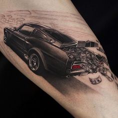 a man's arm with a car on it