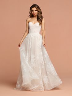 Davinci Bridal 50599 This flowing tulle gown has soft velvet like flowers throughout.  The sweetheart strapless bodice has a beaded belt at the waist extending into a lace up back. Available for 1-2 Week Delivery!!!  Available Sizes: 2,4,6,8,10,12,14,16,18,20  Available Colors: Ivory/Blush, Ivory/Ivory A Line Strapless Wedding Dress, Wedding Dress Corset, Pronovias Wedding Dress, Wedding Gown Styles, Corset Gown, Tulle Neckline, A Line Evening Dress, Dress Couture, Dress Corset