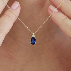 This 14K Gold Oval Cut Sapphire Necklace is designed carefully to brighten your neck. It is suitable for everyday use as well as for your special days. Can be a perfect gift with its stylish and ambitious look. Sapphires have been valued for centuries and have often been associated with qualities such as wisdom, loyalty, nobility, and sincerity. They have a rich history in various cultures and are often linked with royalty and spirituality. Not only on a bracelet or necklace but also in all jewe Sapphire Necklace Simple Zales, Gold And Sapphire Necklace, Dainty Oval Sapphire Jewelry, Blue Oval Pendant Necklace In Dainty Style, Dainty Blue Oval Pendant Necklace, Blue Dainty Oval Pendant Necklace, Elegant Blue Oval Cabochon Necklace, Blue Oval Pendant Necklace With Birthstone, Blue Oval Pendant Necklace For Anniversary