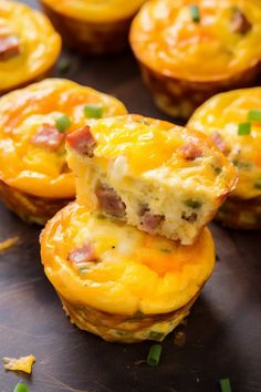 mini ham and cheese muffins stacked on top of each other with green onions