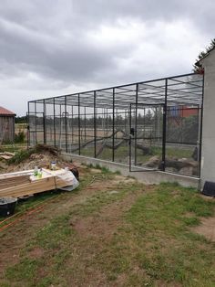 a fenced in area next to a building